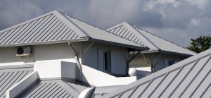 gray r-panel roofs on a white building